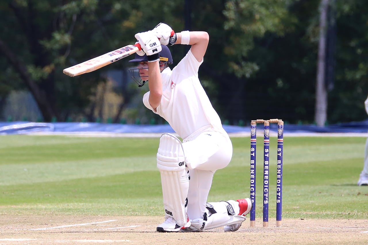 Man in White Jersey Shirt and White Pants Playing Cricket